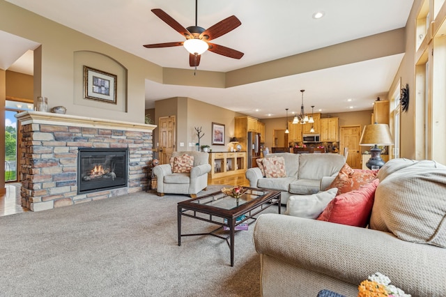 17623 Grist Ct SW, Prior Lake, MN 55372 - living area featuring a chandelier, ceiling fan, a fireplace, recessed lighting, and light colored carpet