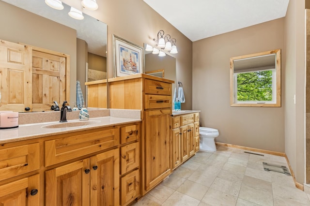 17623 Grist Ct SW, Prior Lake, MN 55372 - full bathroom with baseboards, vanity, and toilet
