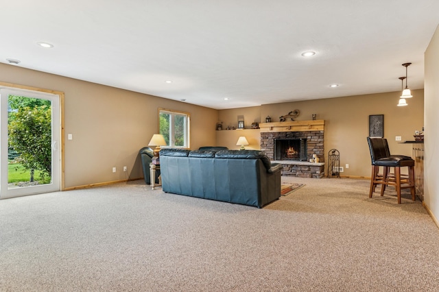 17623 Grist Ct SW, Prior Lake, MN 55372 - carpeted living area featuring a stone fireplace, baseboards, and recessed lighting