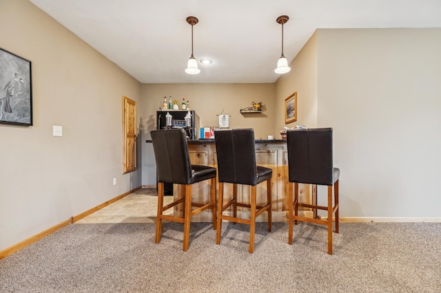 17623 Grist Ct SW, Prior Lake, MN 55372 - indoor dry bar featuring light carpet, baseboards, and hanging light fixtures