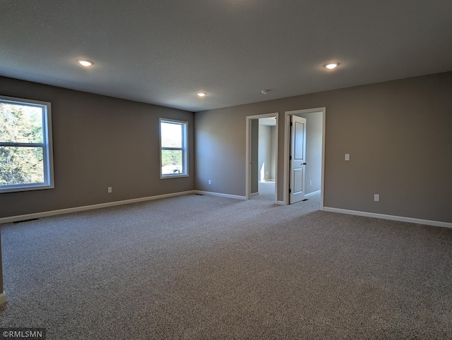 6752 104th St, Cottage Grove, MN 55016 - carpeted spare room with baseboards and recessed lighting