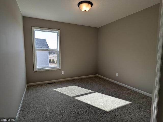 6752 104th St, Cottage Grove, MN 55016 - spare room featuring carpet and baseboards