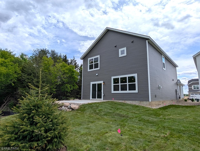 6752 104th St, Cottage Grove, MN 55016 - rear view of property featuring a yard and a patio area