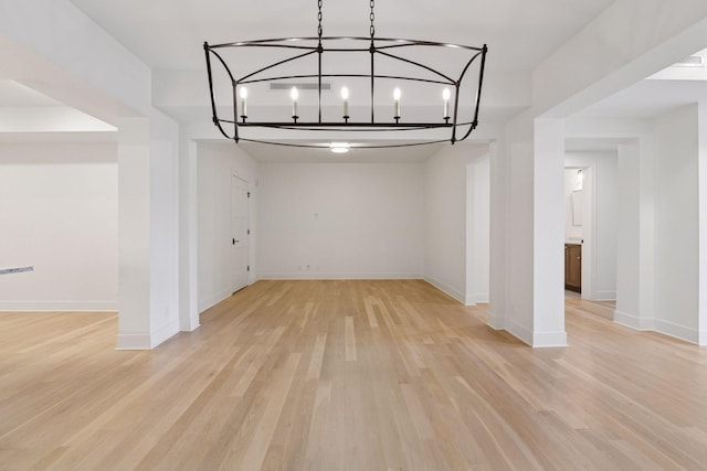 222 Ferndale Rd S Unit 207, Wayzata, MN 55391 - spare room with light wood-type flooring and a chandelier