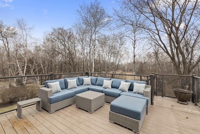 wooden deck with an outdoor living space