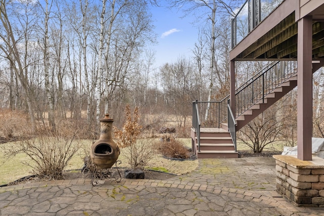 view of yard with a patio and stairs