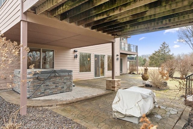 view of patio featuring grilling area and a hot tub
