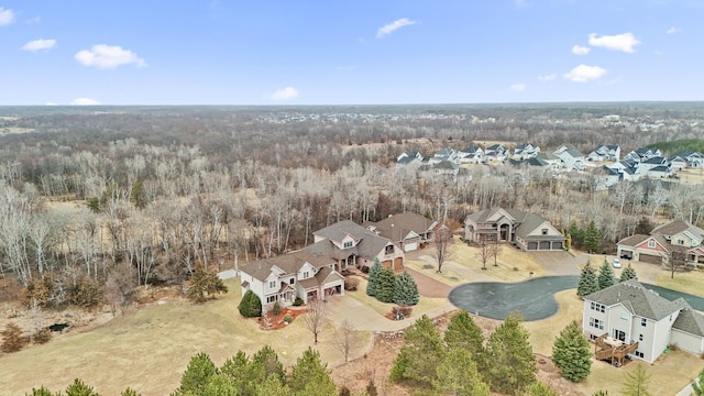 bird's eye view featuring a view of trees and a residential view