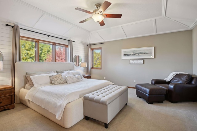 carpeted bedroom with ceiling fan, baseboards, vaulted ceiling, and multiple windows