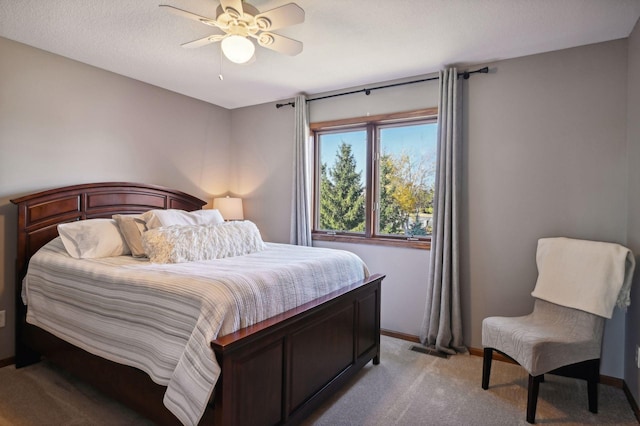 bedroom with baseboards, visible vents, a ceiling fan, and light colored carpet