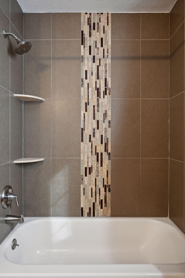 bathroom with shower / bathtub combination