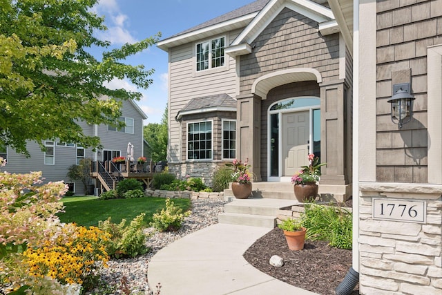 property entrance with stone siding