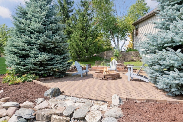 view of patio / terrace with a fire pit