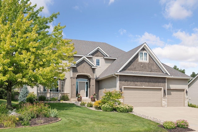 craftsman-style house with concrete driveway, stone siding, roof with shingles, a front yard, and an attached garage