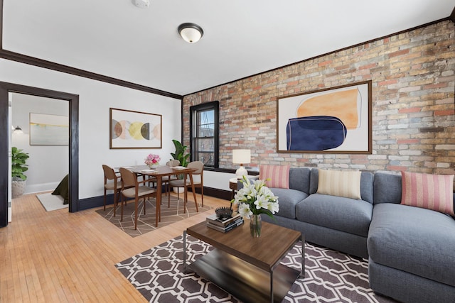2218 Nicollet Ave Unit 22, Minneapolis, MN 55404 - living room with baseboards, brick wall, light wood-style floors, and ornamental molding