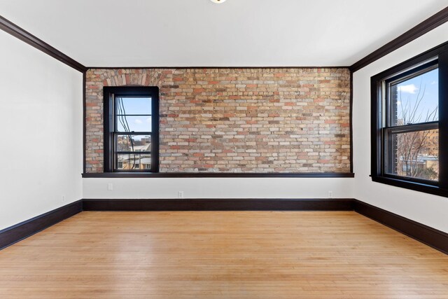 2218 Nicollet Ave Unit 22, Minneapolis, MN 55404 - unfurnished room featuring plenty of natural light, crown molding, and wood finished floors