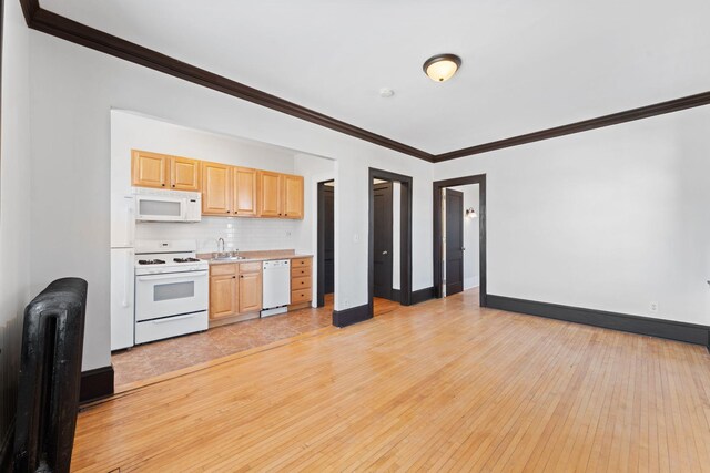 2218 Nicollet Ave Unit 22, Minneapolis, MN 55404 - kitchen with light countertops, light wood-type flooring, white appliances, radiator heating unit, and light brown cabinets