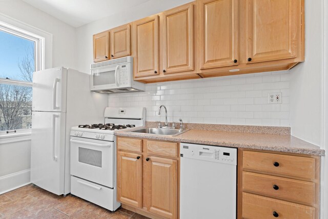 2218 Nicollet Ave Unit 22, Minneapolis, MN 55404 - kitchen with light countertops, a sink, light brown cabinetry, and white appliances