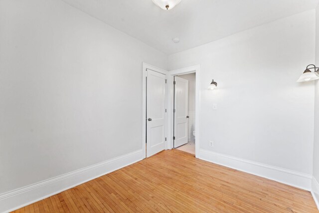 2218 Nicollet Ave Unit 22, Minneapolis, MN 55404 - empty room with baseboards and light wood-style floors