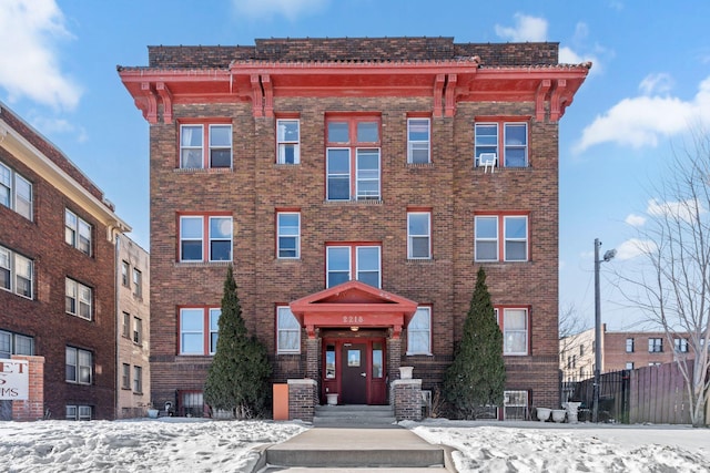 2218 Nicollet Ave Unit 22, Minneapolis, MN 55404 - snow covered property with fence
