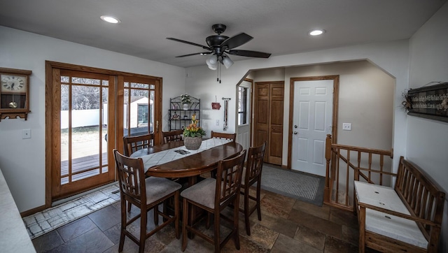 dining area featuring a ceiling fan, stone tile flooring, and recessed lighting
