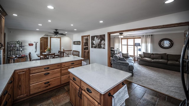 kitchen featuring recessed lighting, light countertops, stone tile floors, and ceiling fan