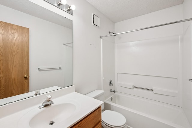 bathroom featuring a textured ceiling, toilet, shower / tub combination, and vanity