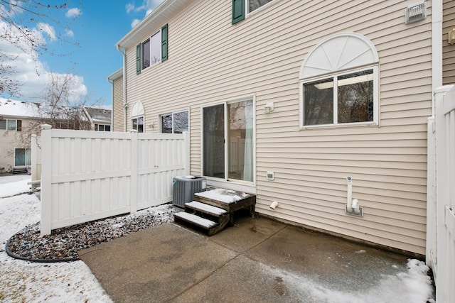 exterior space featuring fence and cooling unit