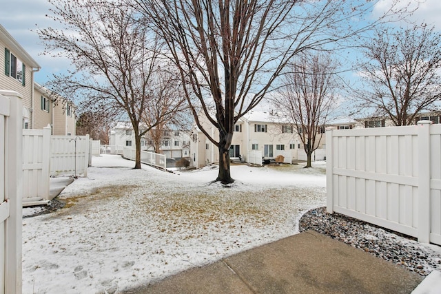view of yard with a residential view and fence