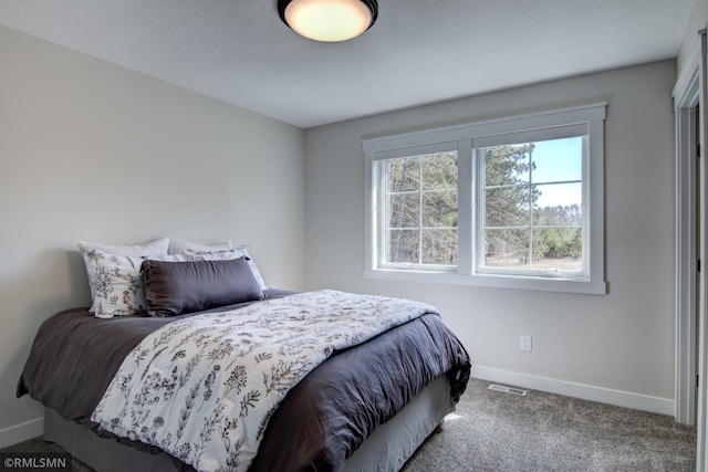 bedroom with visible vents, baseboards, and carpet floors