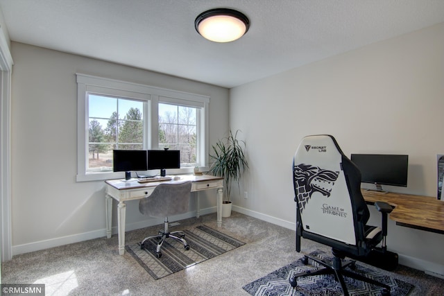 carpeted office with baseboards