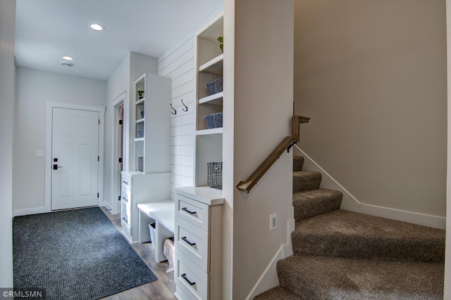 mudroom featuring wood finished floors, baseboards, and recessed lighting