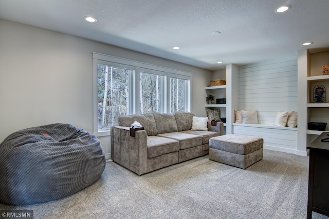 carpeted living room featuring recessed lighting