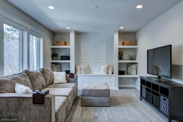 carpeted living room featuring recessed lighting