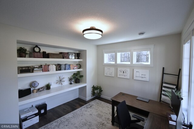 office with baseboards and dark wood-style floors