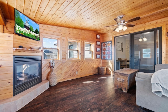 11345 Brenda Blvd, Becker, MN 55308 - living area with wooden walls, a multi sided fireplace, wood ceiling, wood finished floors, and ceiling fan