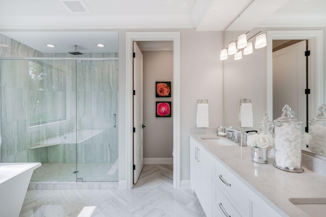 full bathroom featuring visible vents, a shower stall, baseboards, double vanity, and a sink