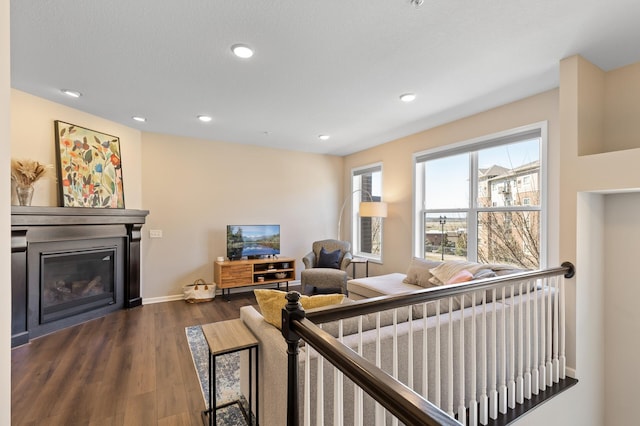 4025 River Valley Way, Eagan, MN 55122 - living room featuring a glass covered fireplace, dark wood-style floors, recessed lighting, and baseboards