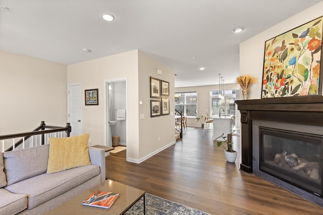 4025 River Valley Way, Eagan, MN 55122 - living room featuring dark wood-type flooring, recessed lighting, baseboards, and a glass covered fireplace