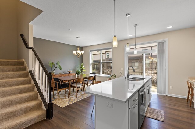 4025 River Valley Way, Eagan, MN 55122 - kitchen with a sink, dark wood-style flooring, stainless steel dishwasher, decorative light fixtures, and light countertops