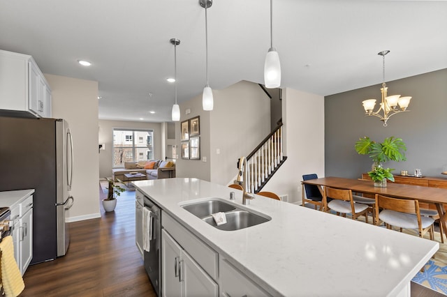 4025 River Valley Way, Eagan, MN 55122 - kitchen featuring a sink, dark wood finished floors, open floor plan, white cabinets, and decorative light fixtures