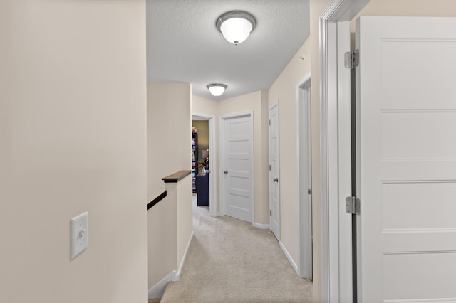 4025 River Valley Way, Eagan, MN 55122 - corridor featuring light colored carpet, baseboards, and a textured ceiling