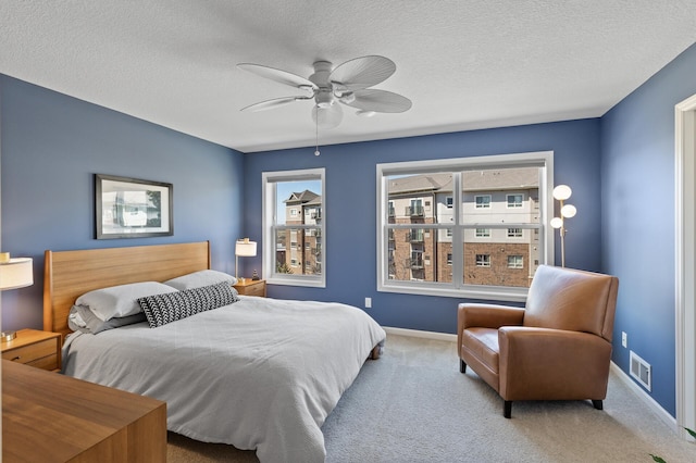 4025 River Valley Way, Eagan, MN 55122 - bedroom with baseboards, carpet floors, ceiling fan, and a textured ceiling