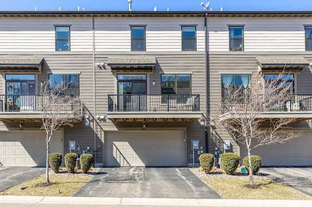 4025 River Valley Way, Eagan, MN 55122 - view of front of property with a garage, a balcony, and driveway