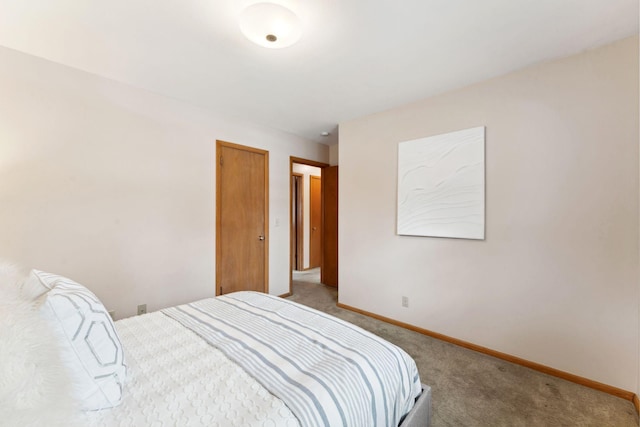 carpeted bedroom with baseboards