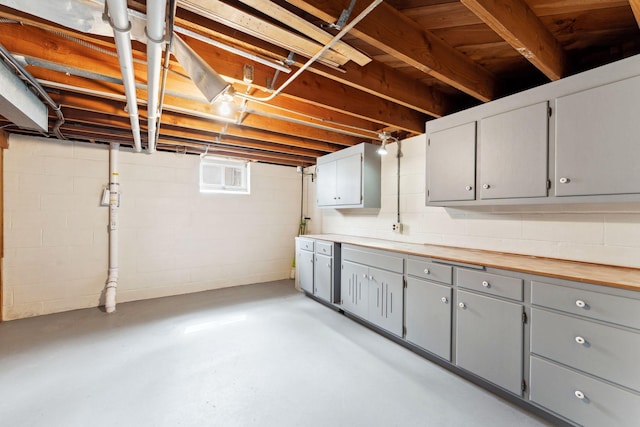 basement featuring concrete block wall