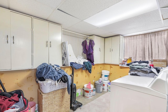 basement featuring washer and dryer and a paneled ceiling