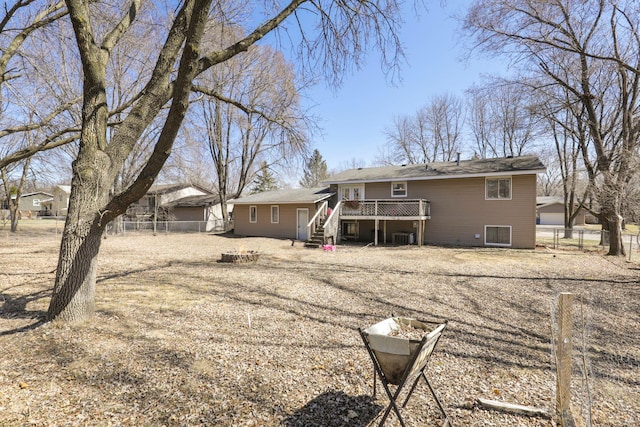 rear view of house featuring stairs, a deck, and fence private yard