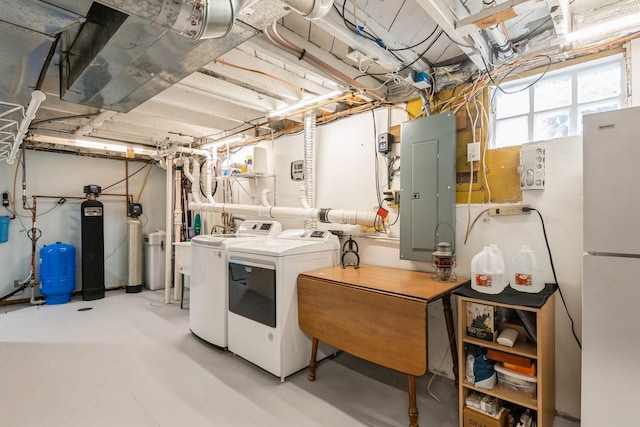 laundry area featuring electric panel, independent washer and dryer, and laundry area