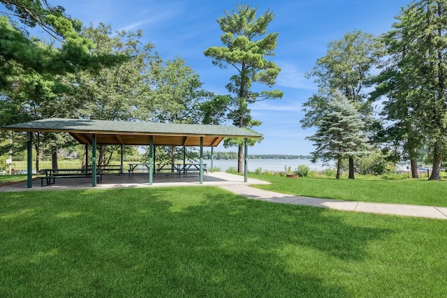 view of property's community featuring a gazebo, a yard, and a water view